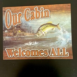 Metal Sign, says “Our Cabin Welcome All”